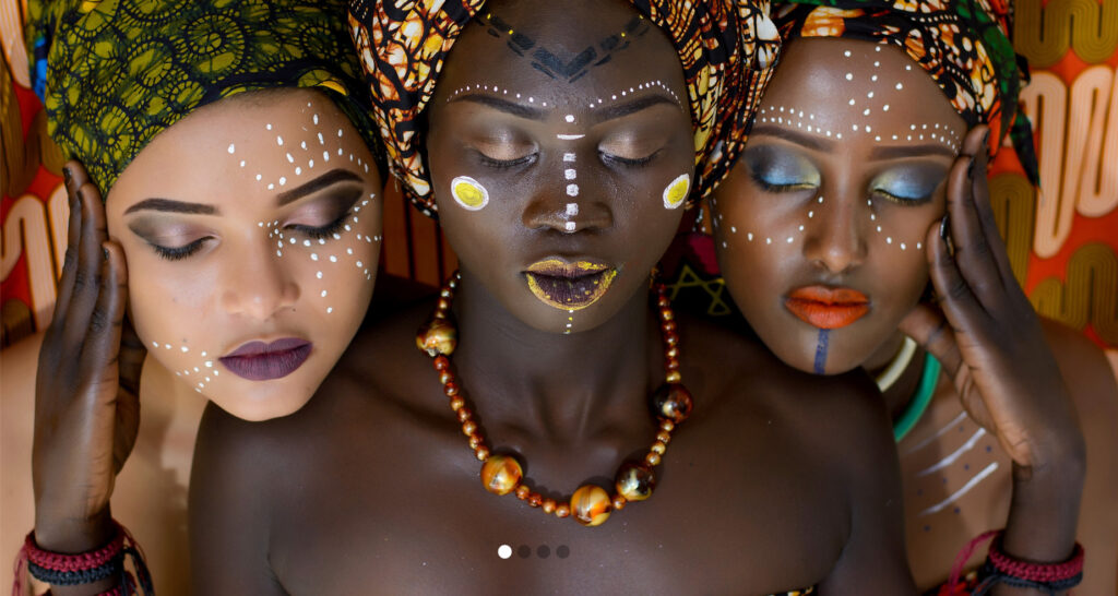 Three women in historical island garb.